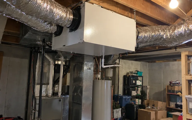 Heat recovery ventilator mounted in an unfinished basement